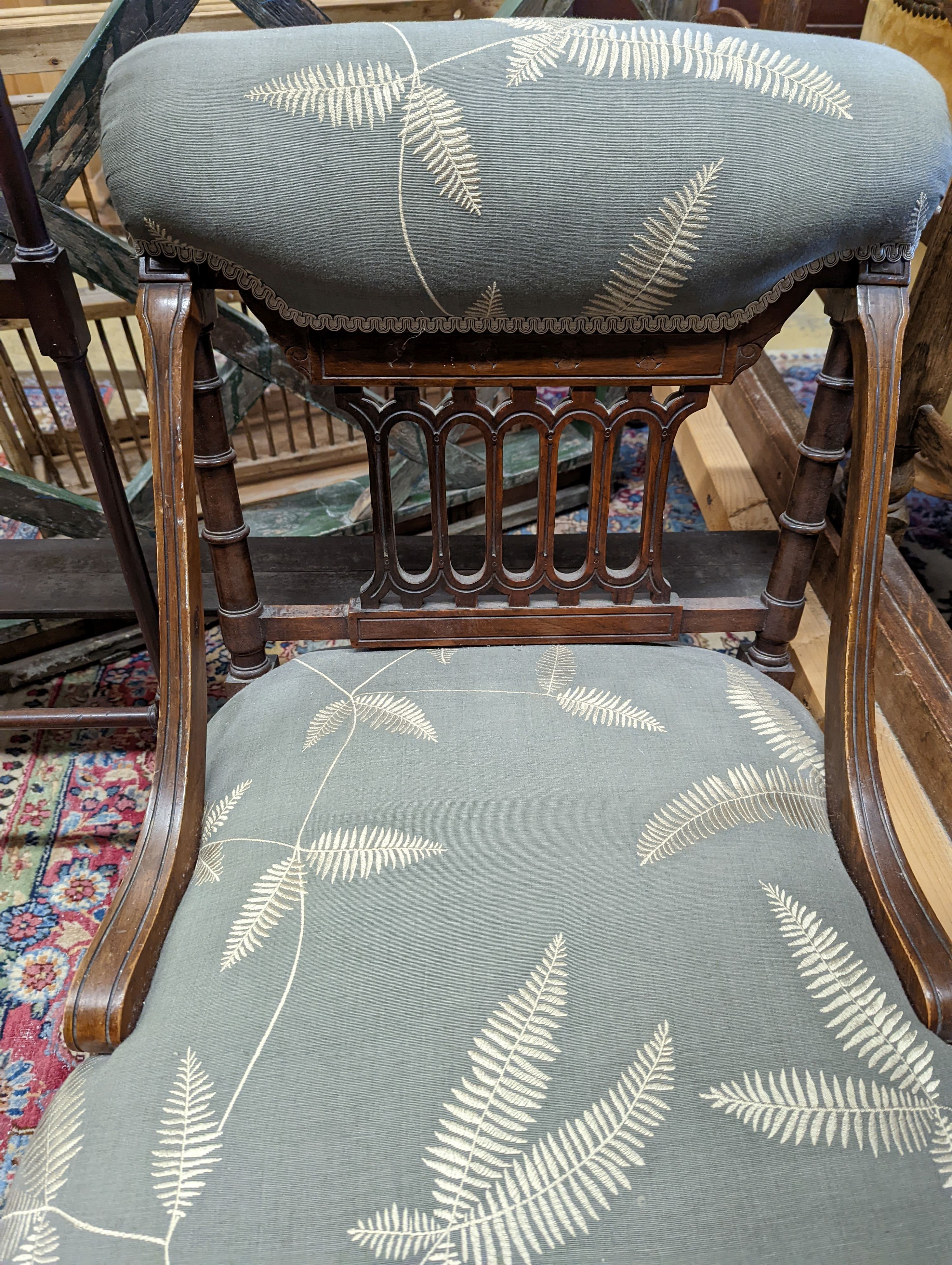 A Victorian upholstered nursing chair, together with a later fire screen